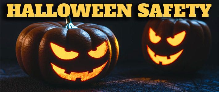 Two carved spooky pumpkins. The text on this image reads "Halloween Safety".