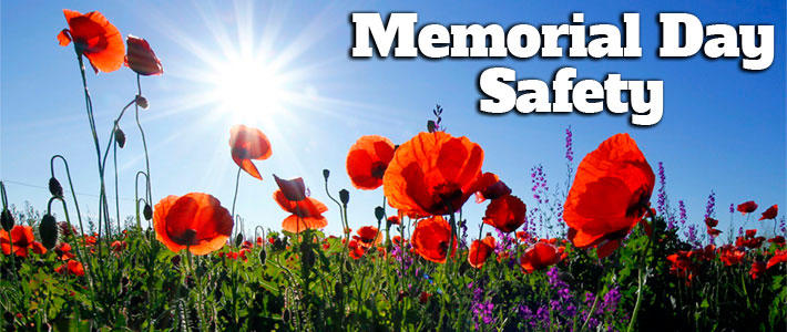 A field of red tulips. The text on this image reads "Memorial Day Safety".